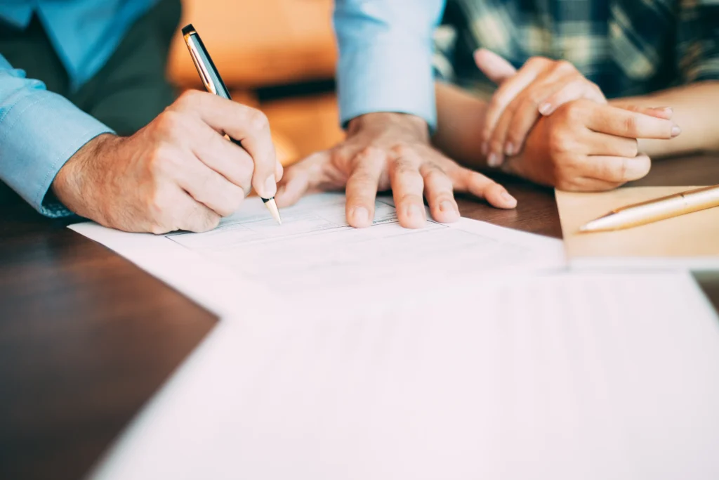 A modern family discussing future plans with a professional offering Will Writing Service Leicester