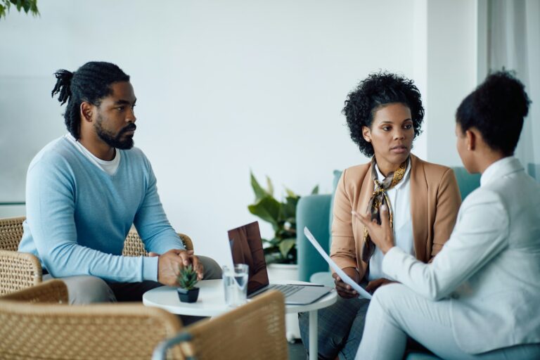A confidential discussion between a client and a professional about Will Writing Services Leicester in a private office setting
